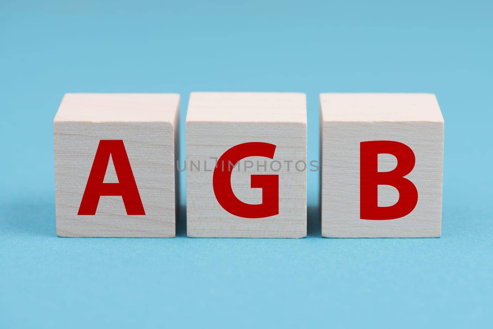 The word AGB is standing on wooden cubes, german language, general terms and conditions for businesses