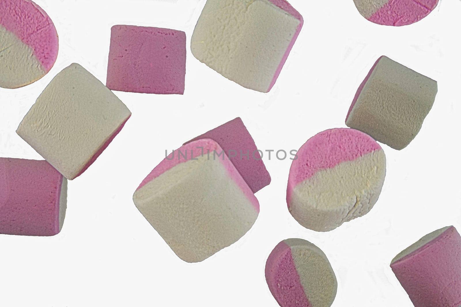 Falling marshmallow isolated on white background, clipping path, full depth of field. White and pink marshmallows falling. Marshmallow candy background.