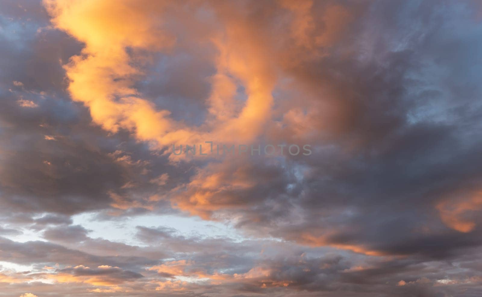 Orange afternoon sun lit on dark blue sunset sky, nature background.