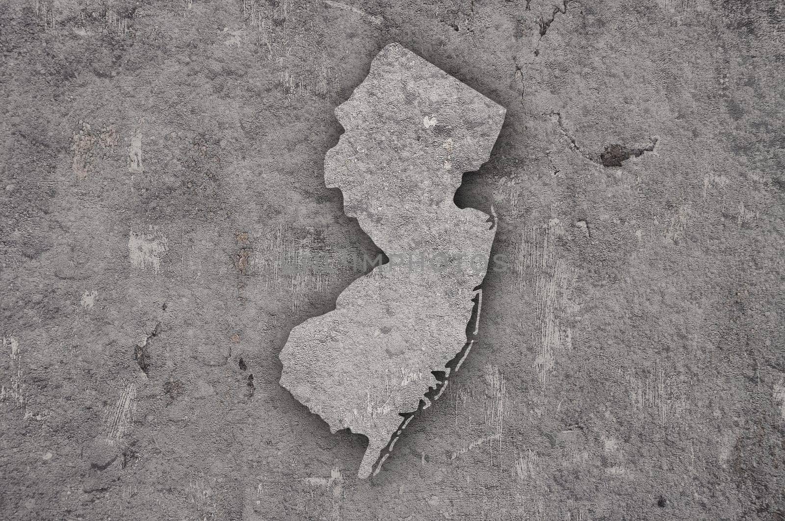 Map of New Jersey on weathered concrete