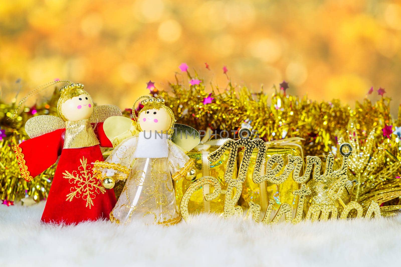Chrismas doll with Christmas ornaments and decorations with bokeh background