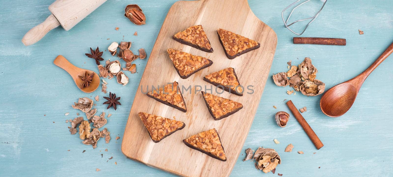 Nut corner, traditional german sweets called Nussecke, covered with chocolate, christmas baking