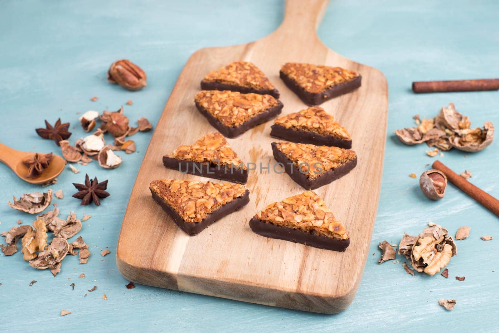 Nut corner, traditional german sweets called Nussecke, covered with chocolate, christmas baking