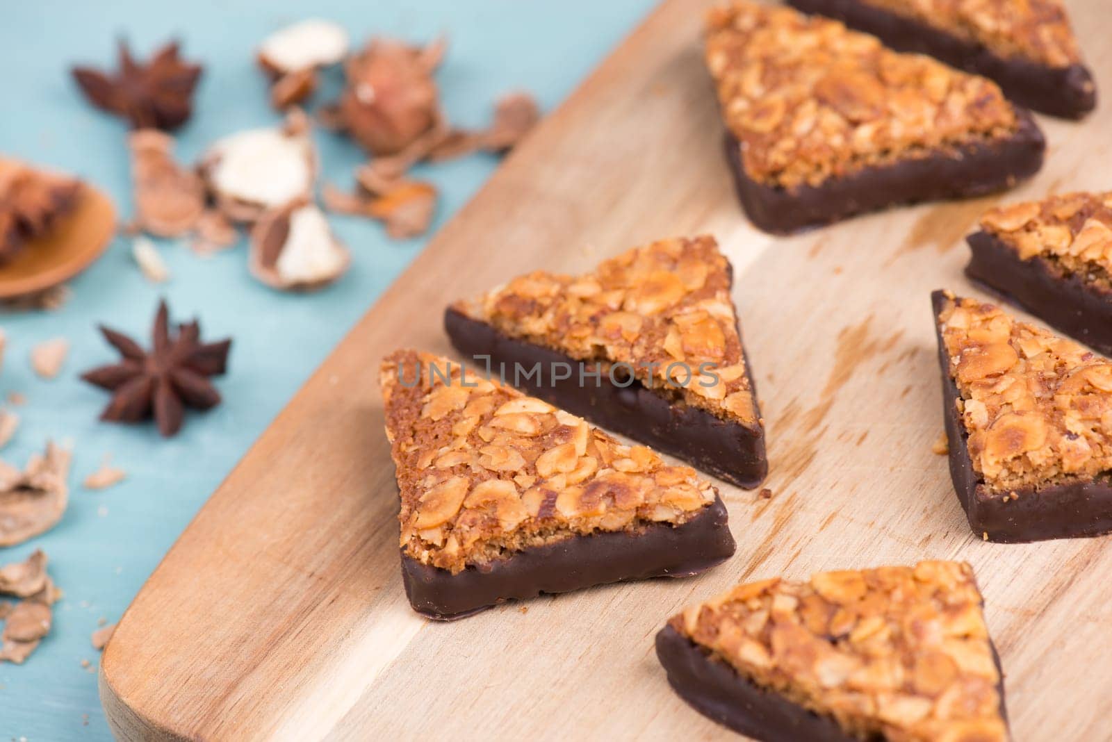 Nut corner, traditional german sweets called Nussecke, covered with chocolate, christmas baking