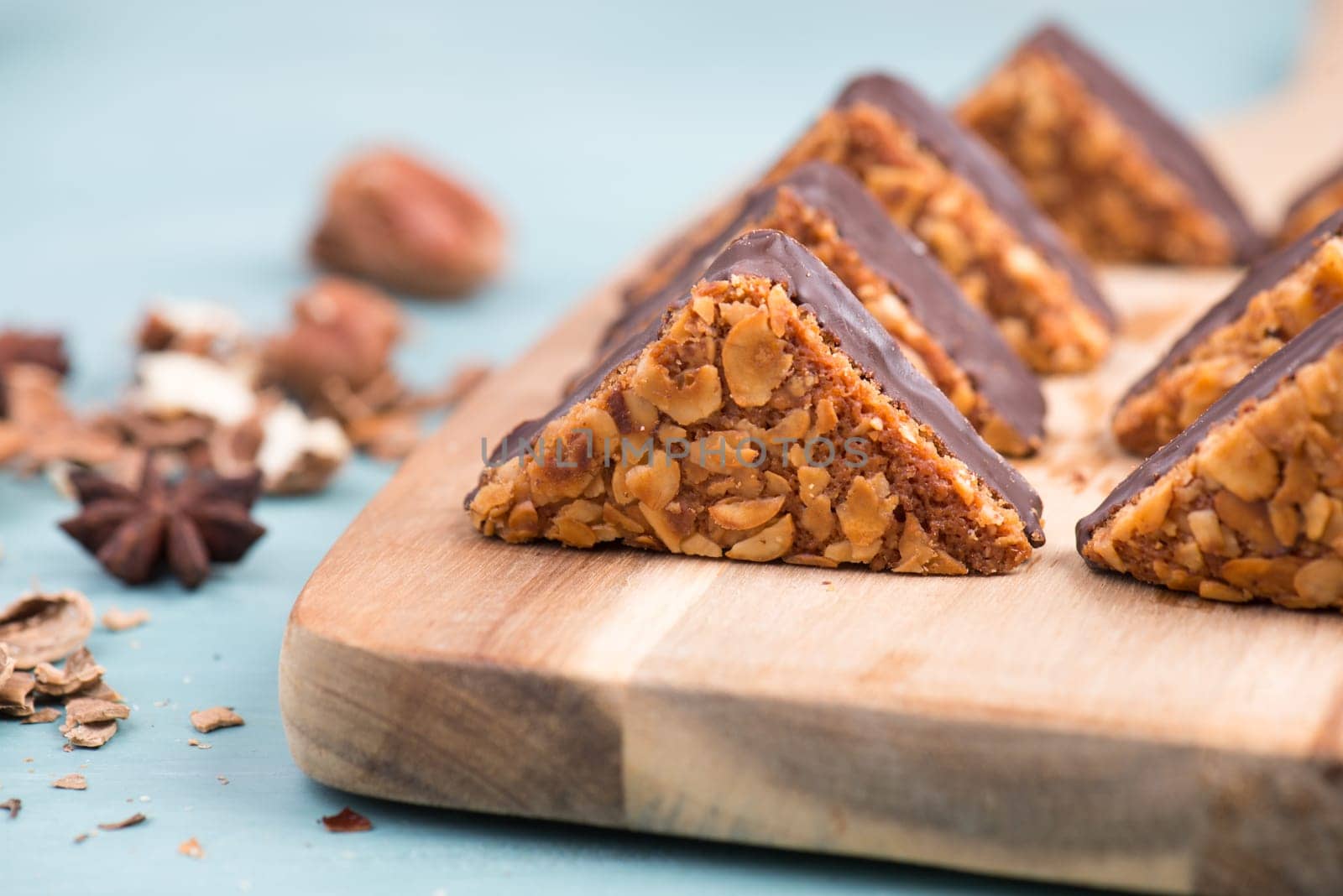 Nut corner, traditional german sweets called Nussecke, covered with chocolate, christmas baking