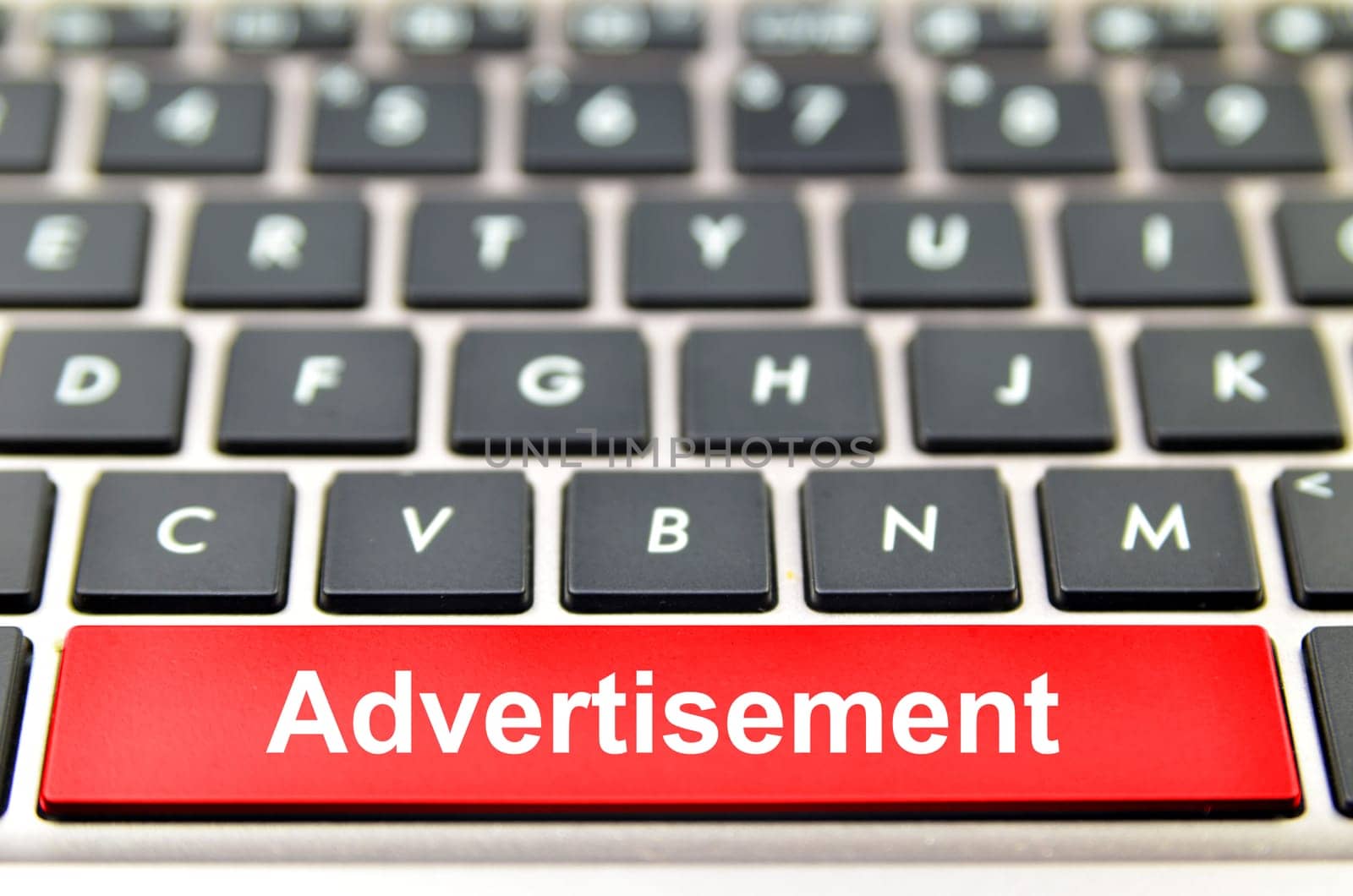 Advertisement word on computer keyboard, 3D rendering