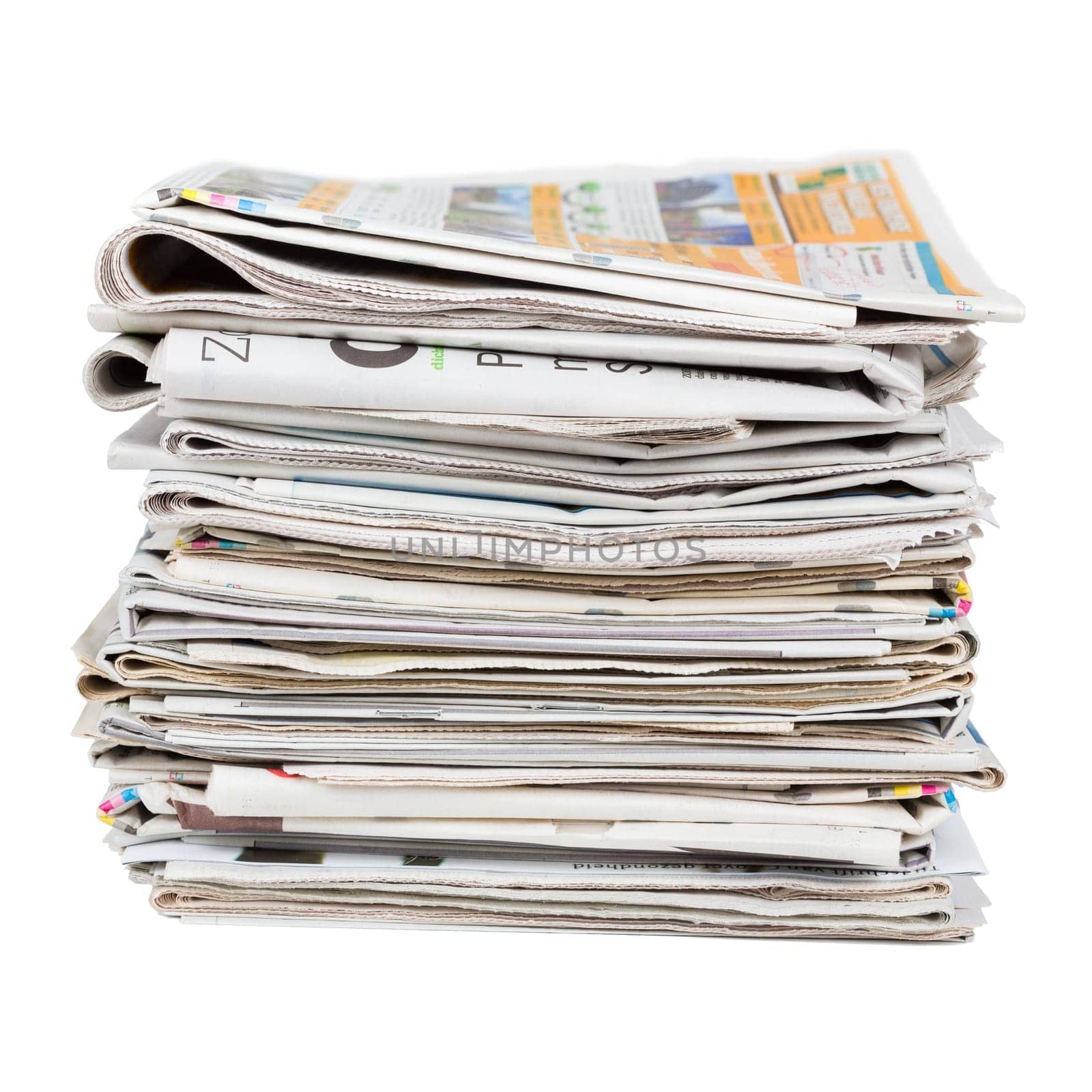 Pile of generic newspapers isolated on white background closeup shot. News and updates concept.
