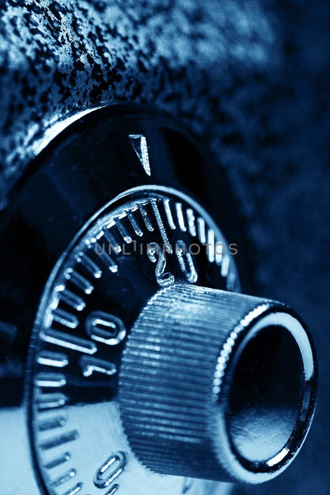 Combination lock. Dark blue colorized. Shallow DOF. Safety concept.