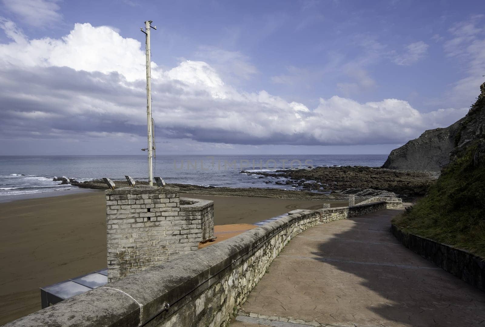 Detail of pedestrian access to a beach in summer