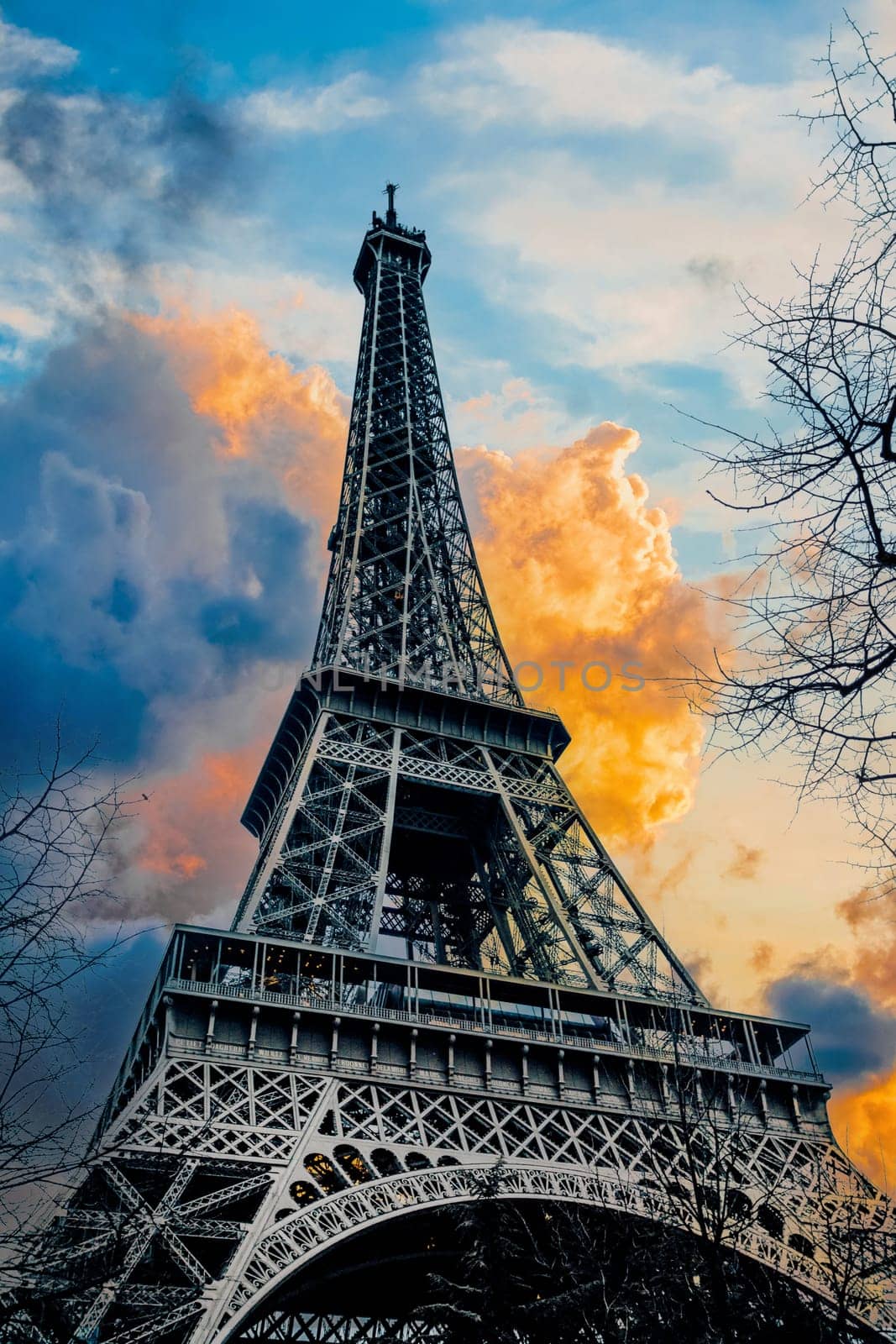 View of Eiffel Tower on sunset sky background