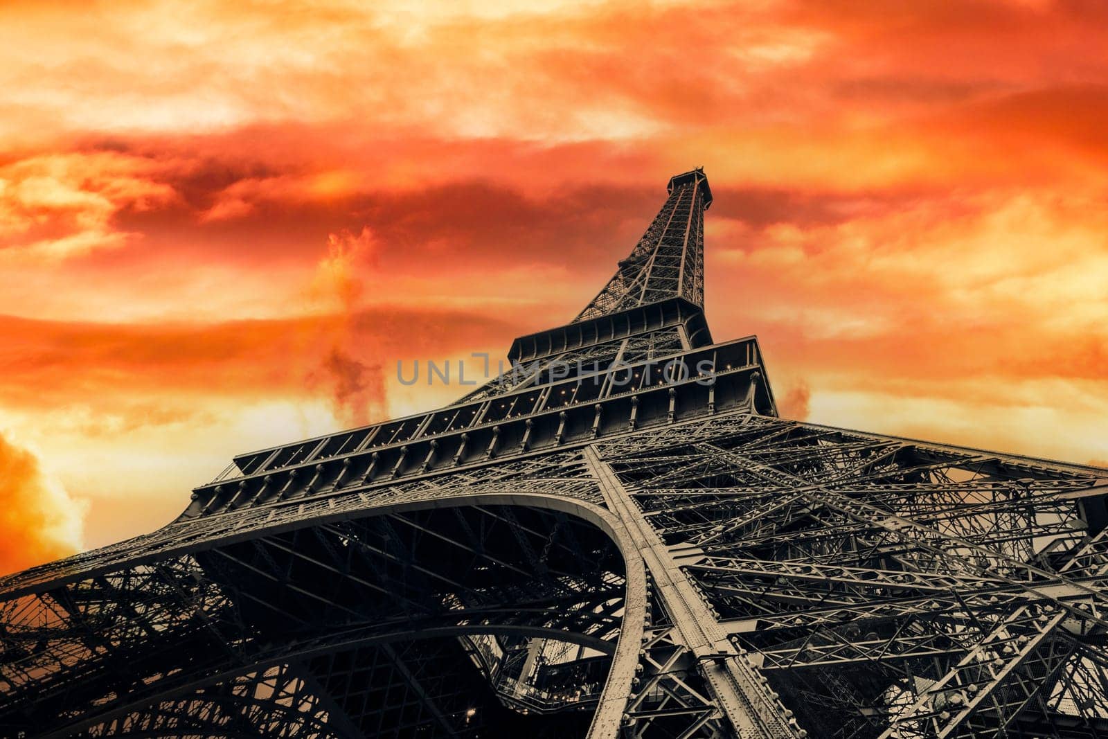 View of Eiffel Tower on sunset sky background