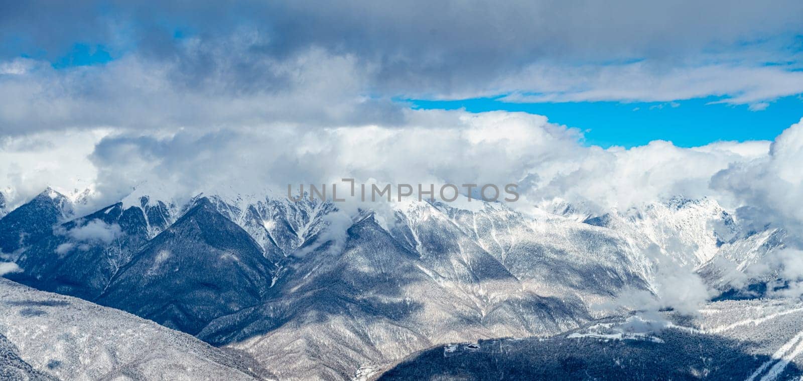 mountains with white snow and blue sky