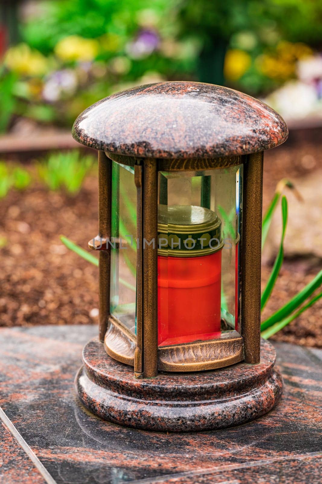 memorial candles light on grave