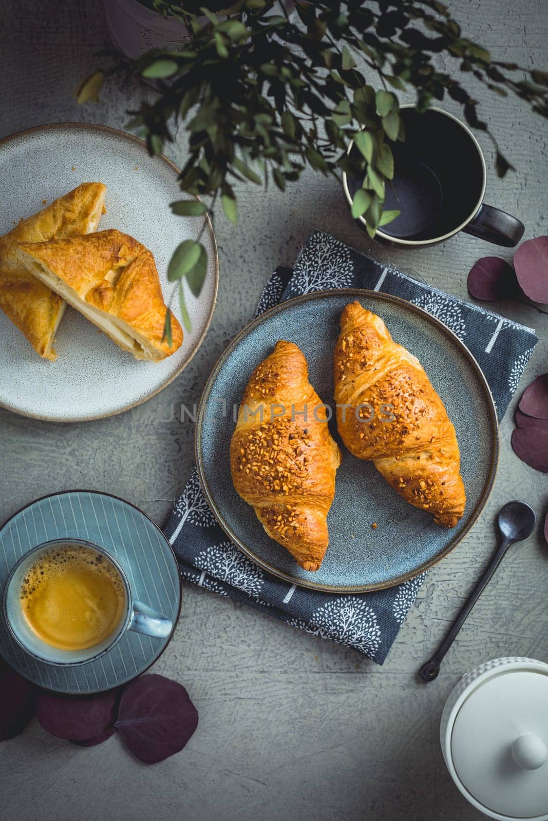 Breakfast - cup of coffee, croissants and curd cheese turnover.