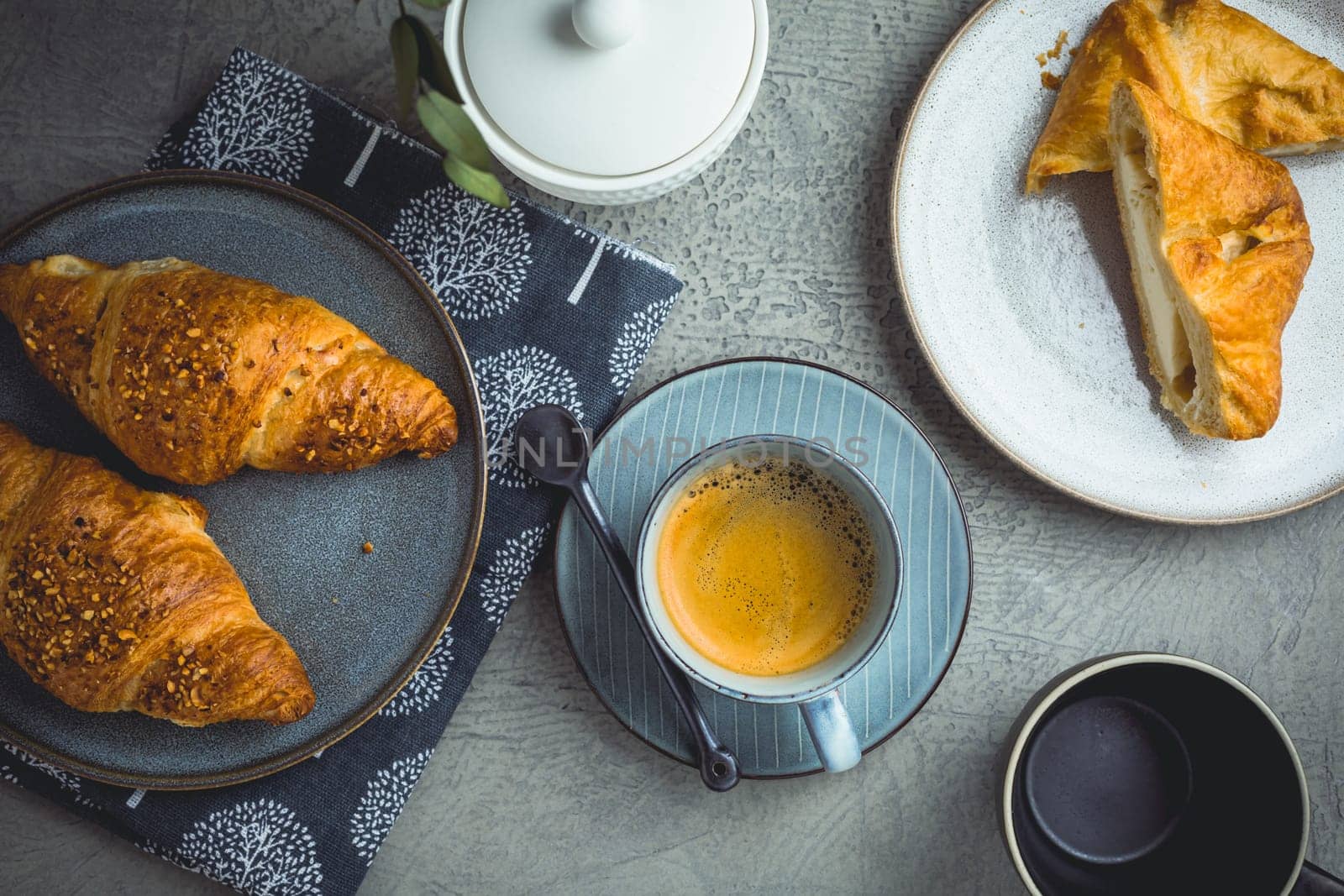 Breakfast - cup of coffee, croissants and curd cheese turnover.