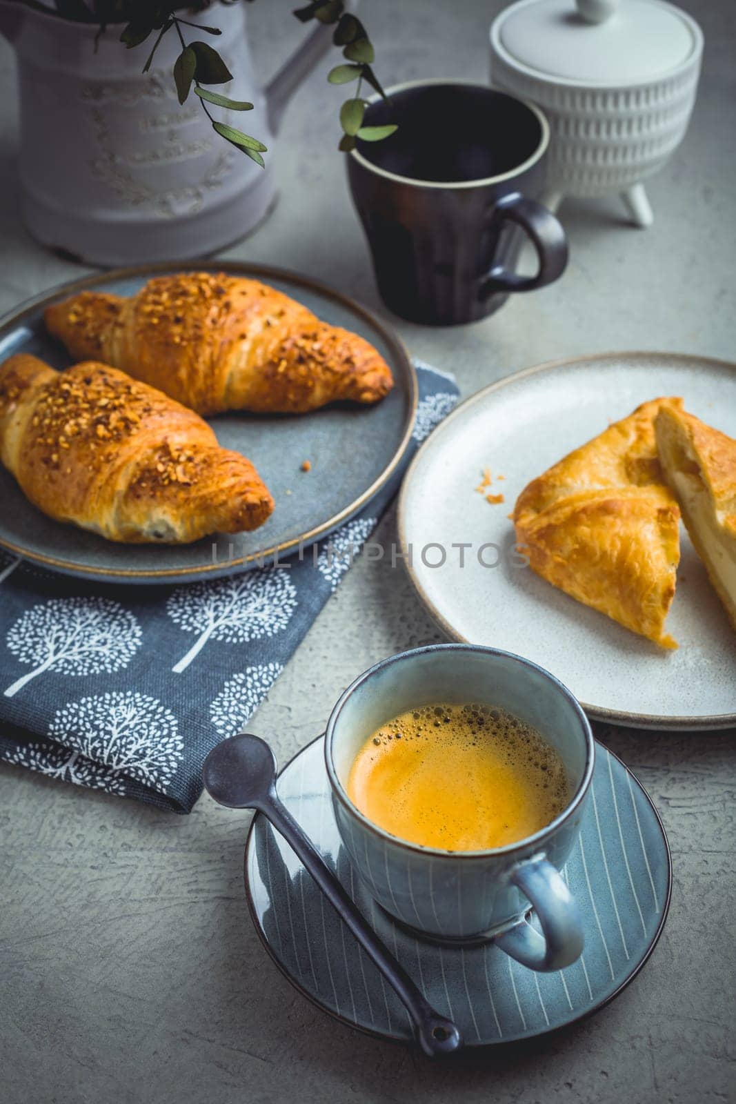 Breakfast - cup of coffee, croissants and curd cheese turnover.