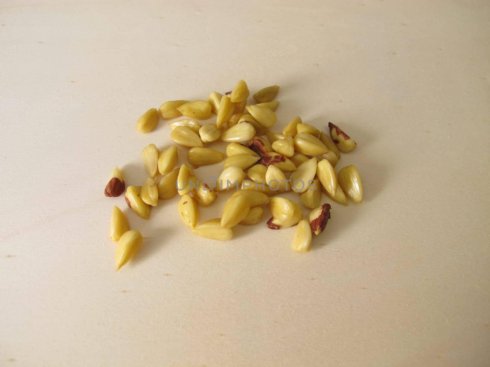 Shelled beechnuts without hull on a wooden board