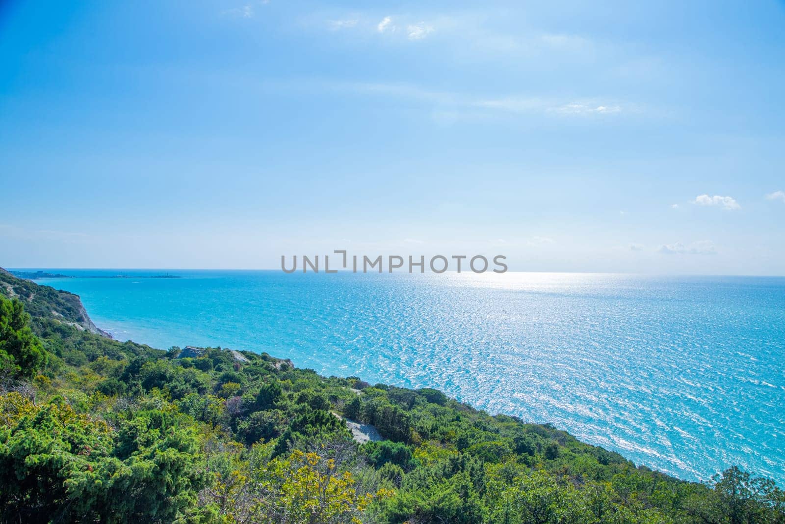 Blue sea against the sky, view from the cliff. . High quality photo