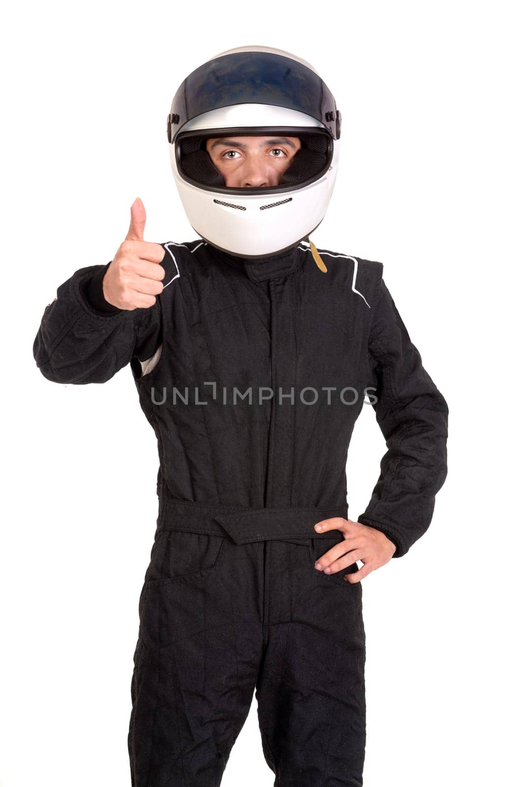 Racing driver posing with helmet isolated in white