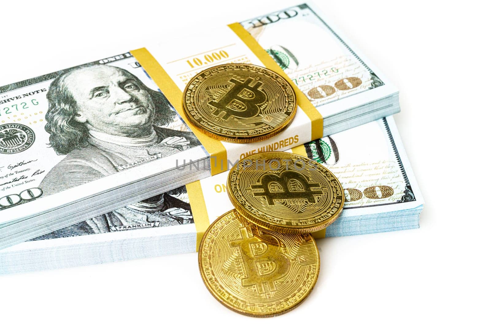coins of bitcoin with heap of dollar bill on white. Business concept