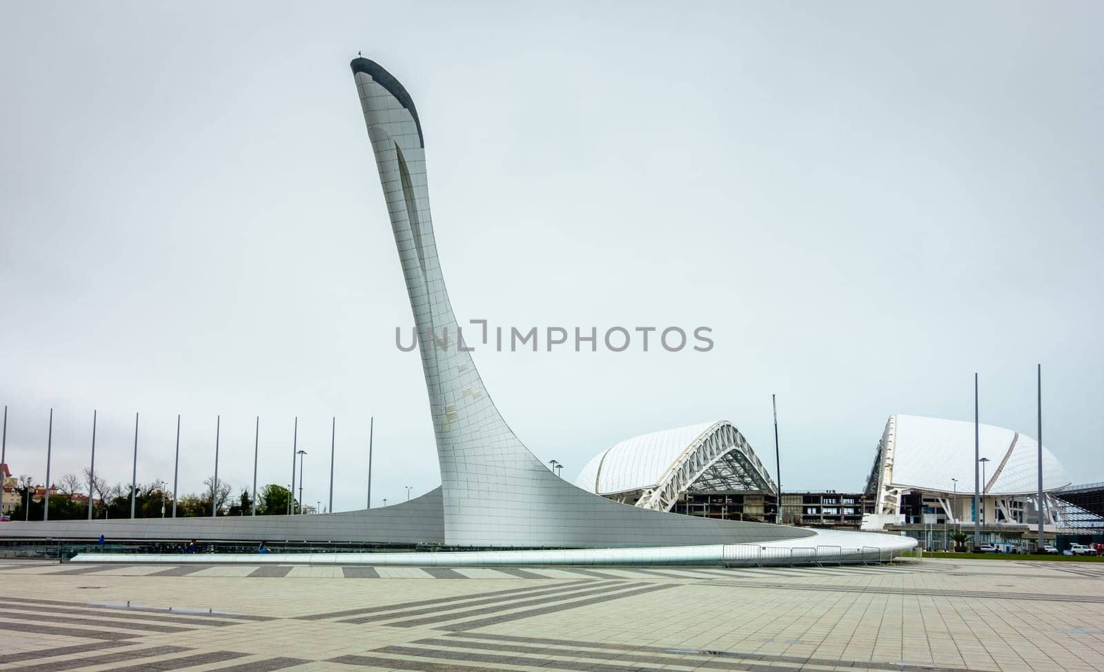sochi, Adler, Russia, April 14, 2016: View of Olympic Torch Monument and stadium Fisht in Olympic Park in Sochi after the Winter Olympics of 2015