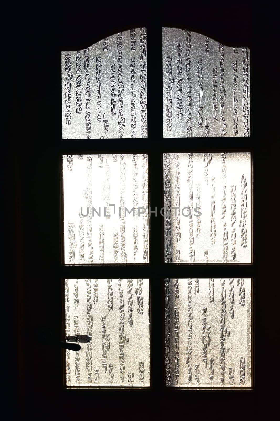 decorative glass in wooden doors.