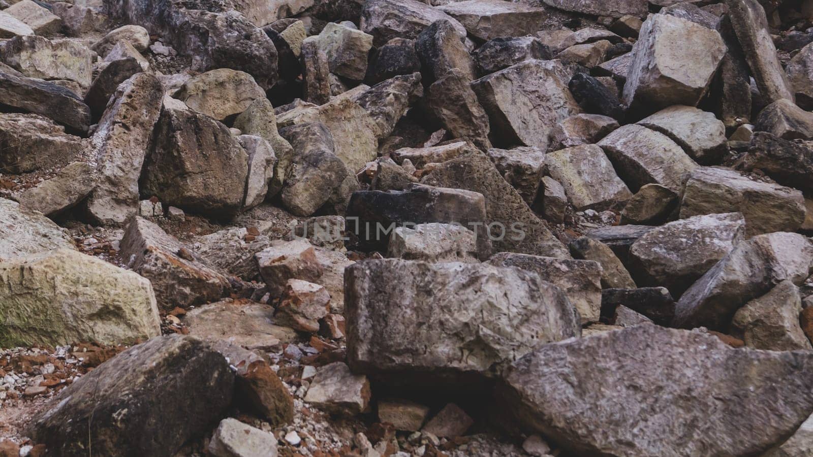 Pile of stones background. heap of rocks. ruins of destroyed buildings