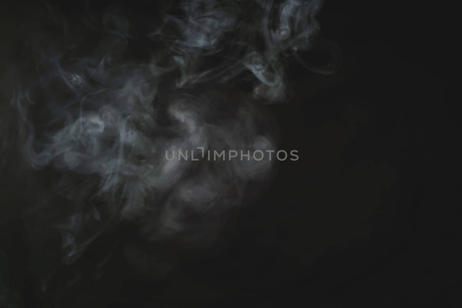 Smoke in the dark. abstract fog on the black background