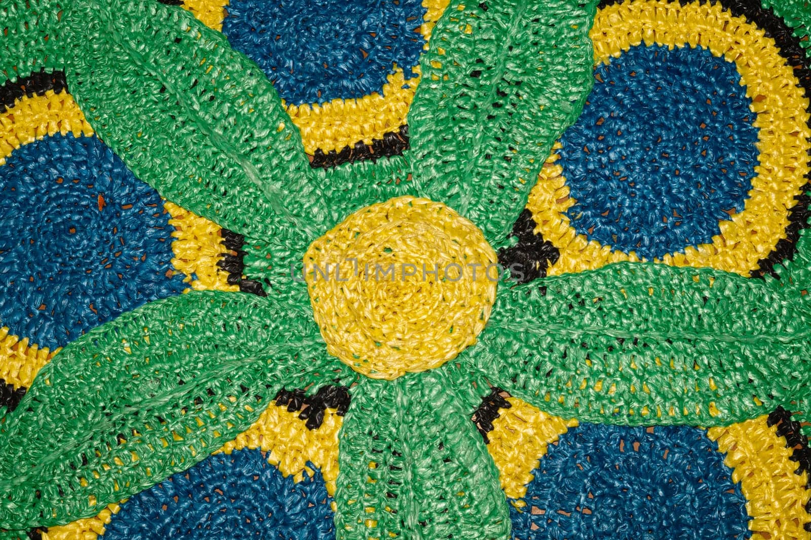 Rug from recycled material. recycled textiles used to make colorful rugs. reuse concept