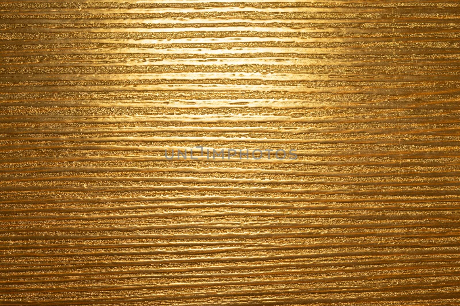 Uneven golden texture background. brown background