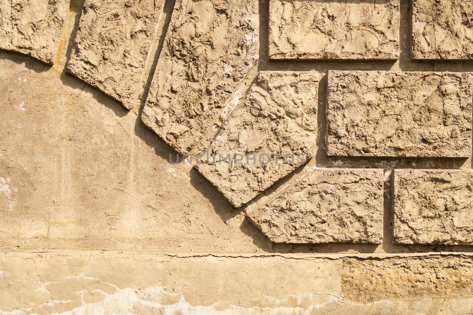 Old brick wall background with copy space. wall from squared bricks. cracked stone wall texture