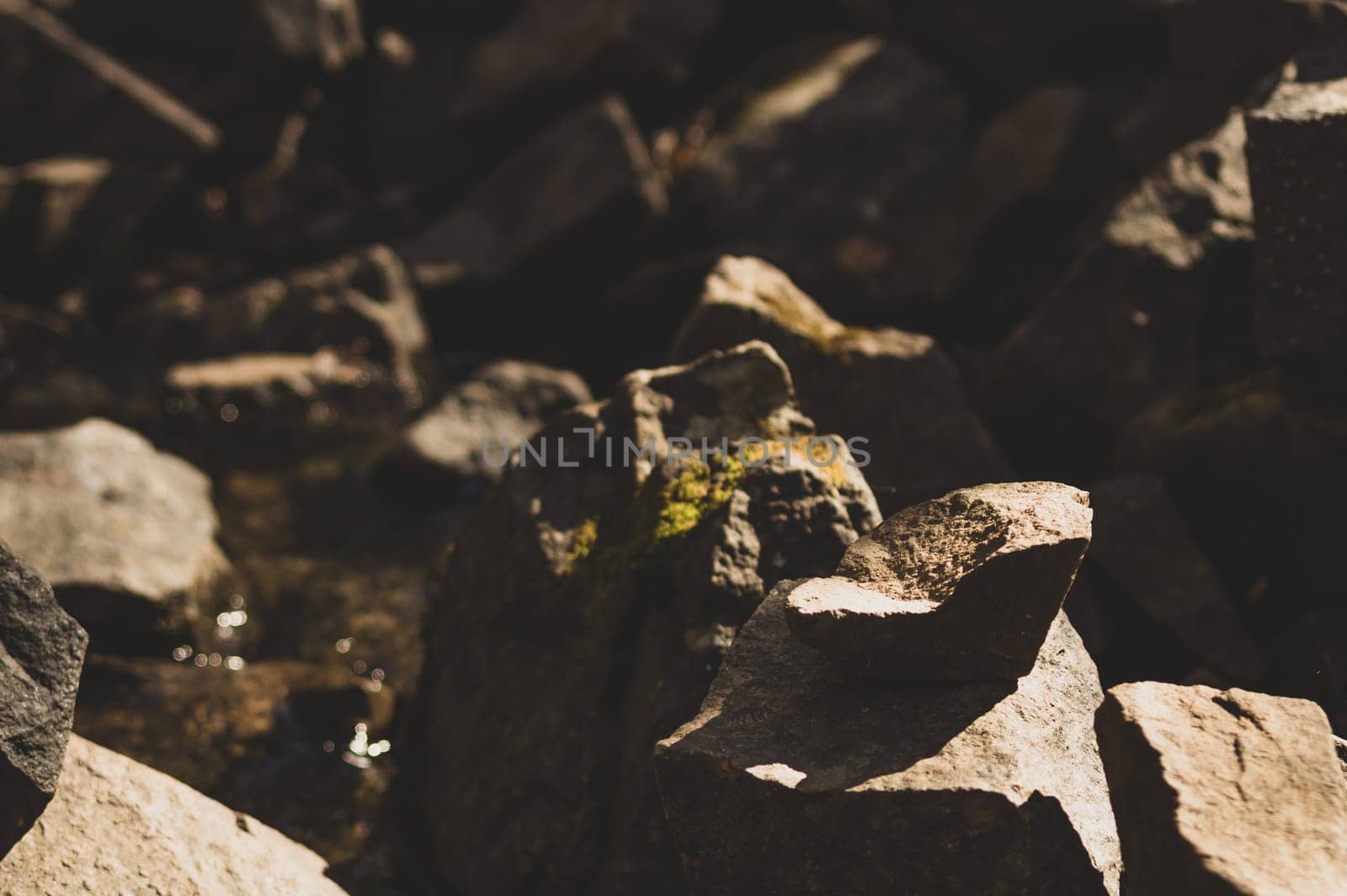 small stone turrets in the forest. stone sculptures background