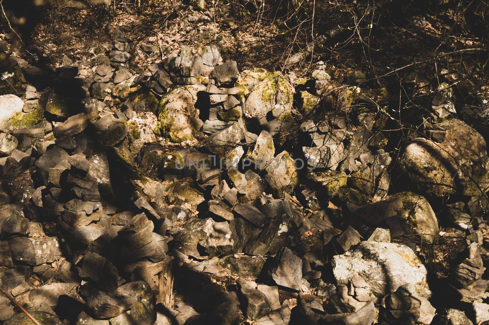 small stone turrets in the forest. stone sculptures background