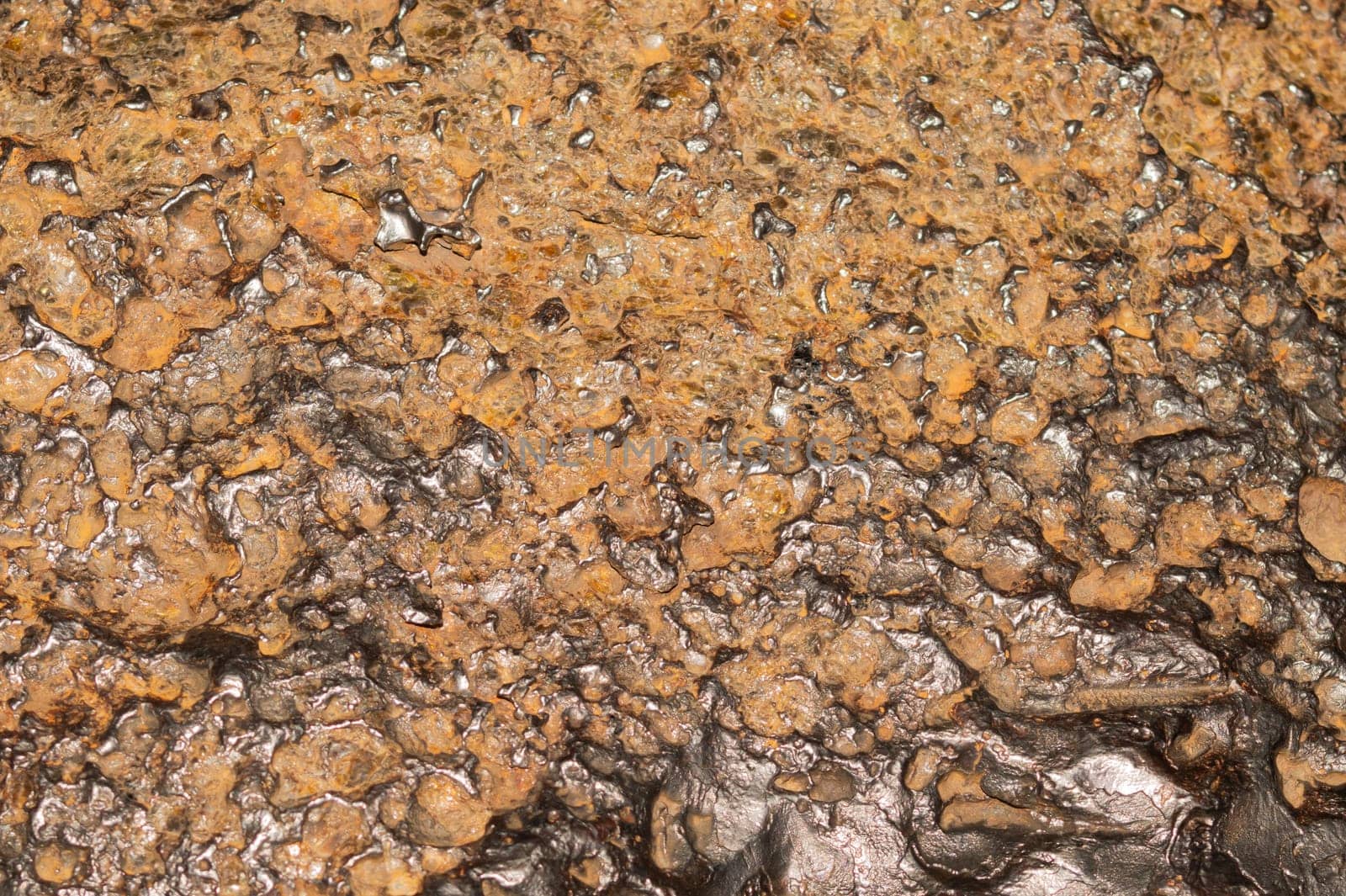Meteorite texture background. meteorite surface close up. stone backdrop