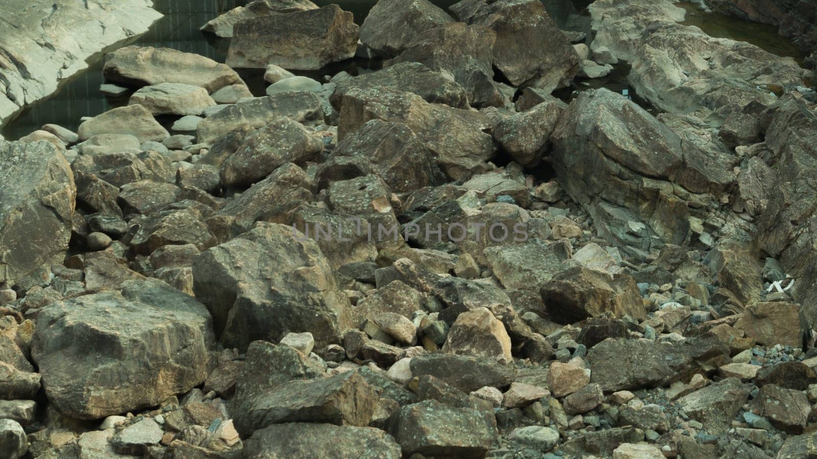 Rocky abstract background. stones in the dry course backdrop