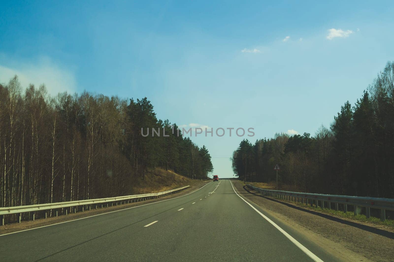 Car driving on a highway. auto moving on a roadway background