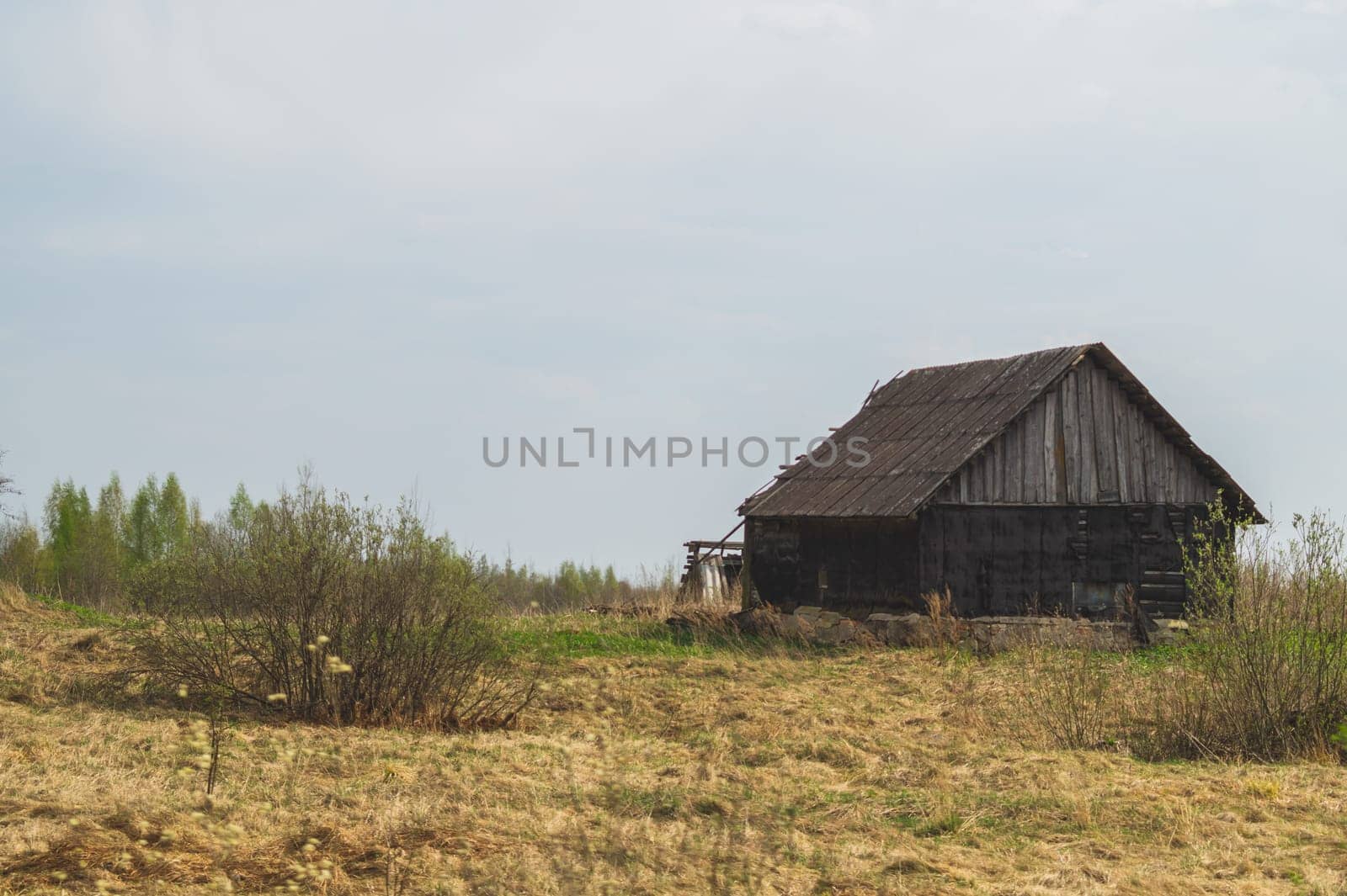 Old wooden house on the countryside. house standing alone among the field