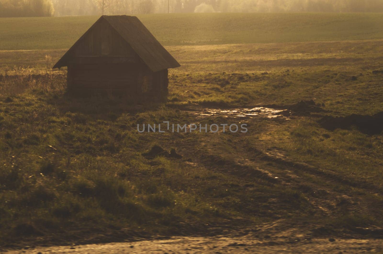 Old wooden house on the countryside. house standing alone among the field