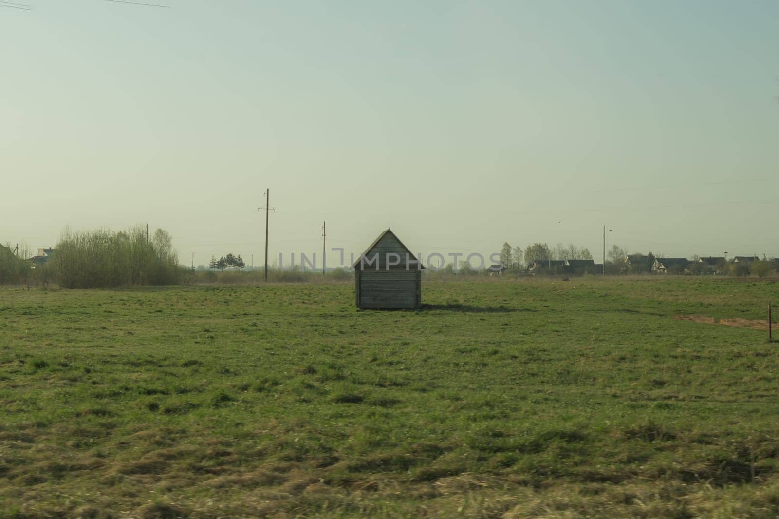 Old wooden house on the countryside. house standing alone among the field