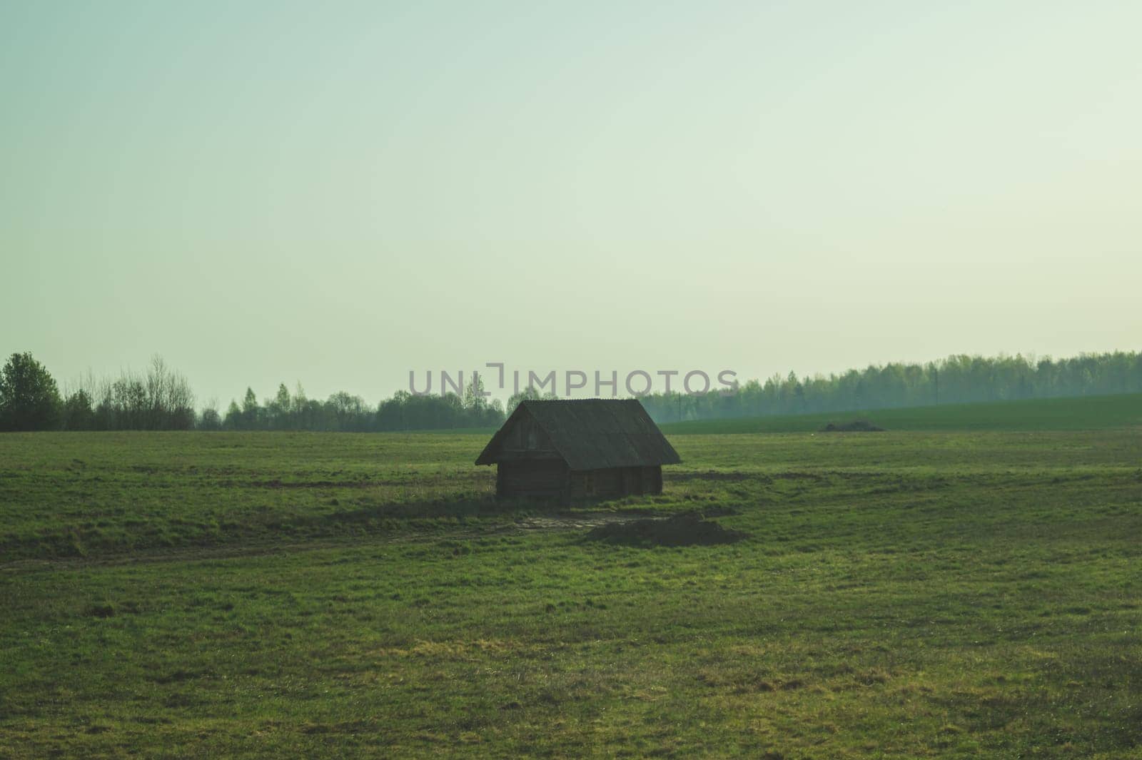 Old wooden house on the countryside. house standing alone among the field