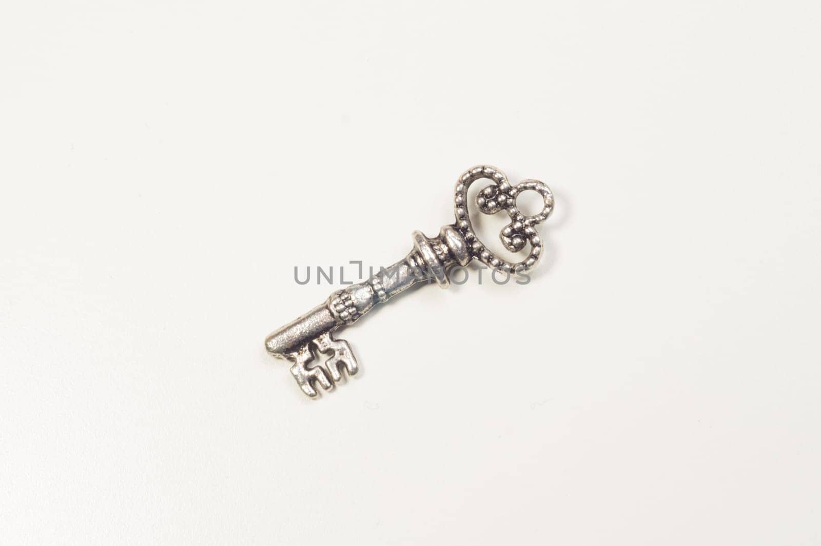 Vintage key isolated on white background. safety and security concept