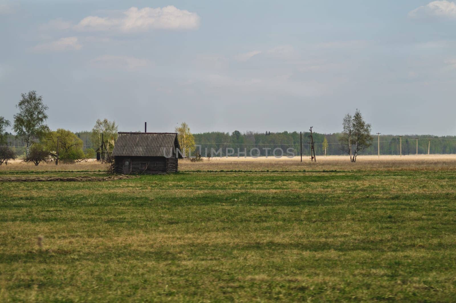 Old wooden house on the countryside. house standing alone among the field