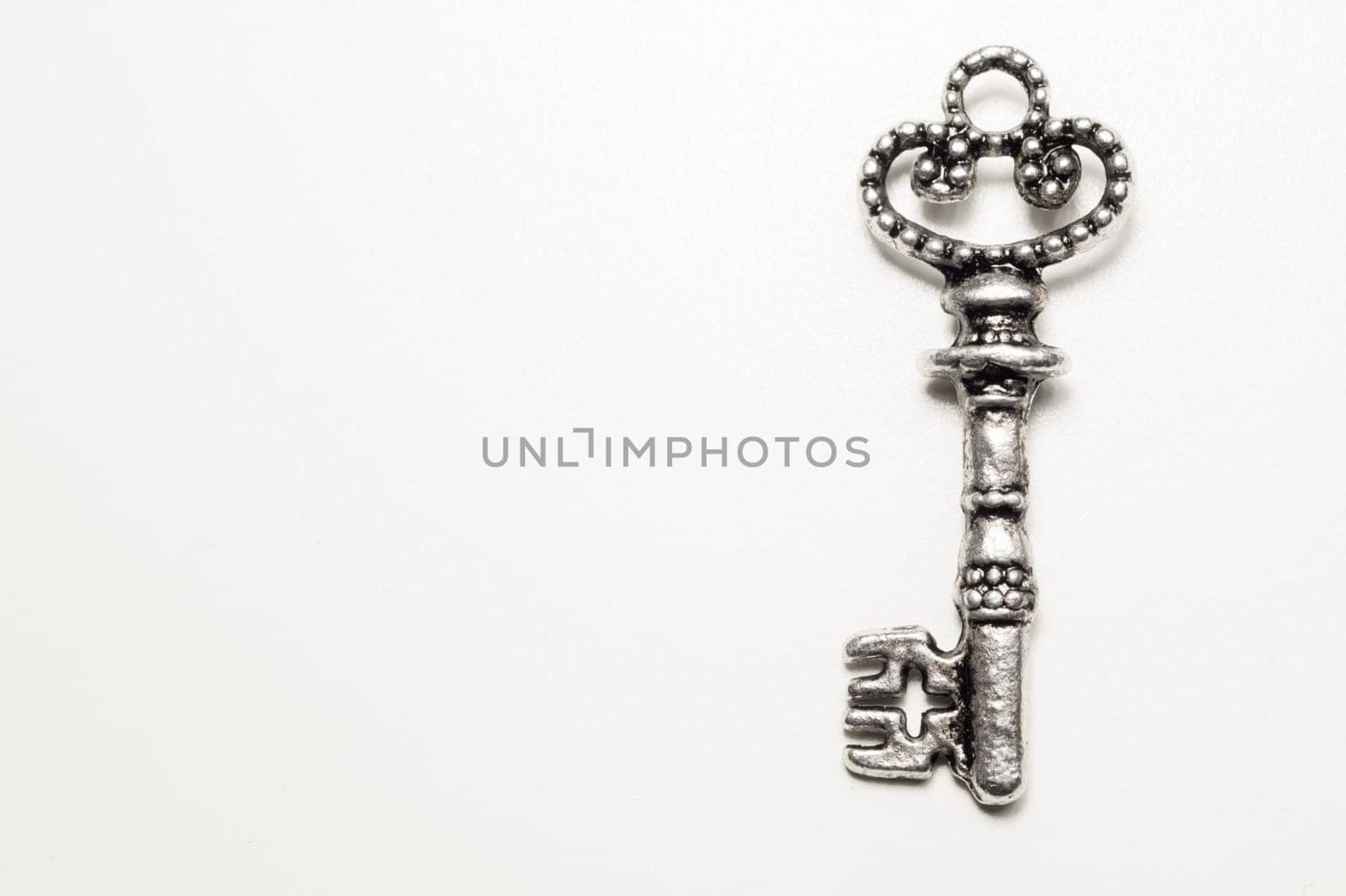 Vintage key isolated on white background. safety and security concept