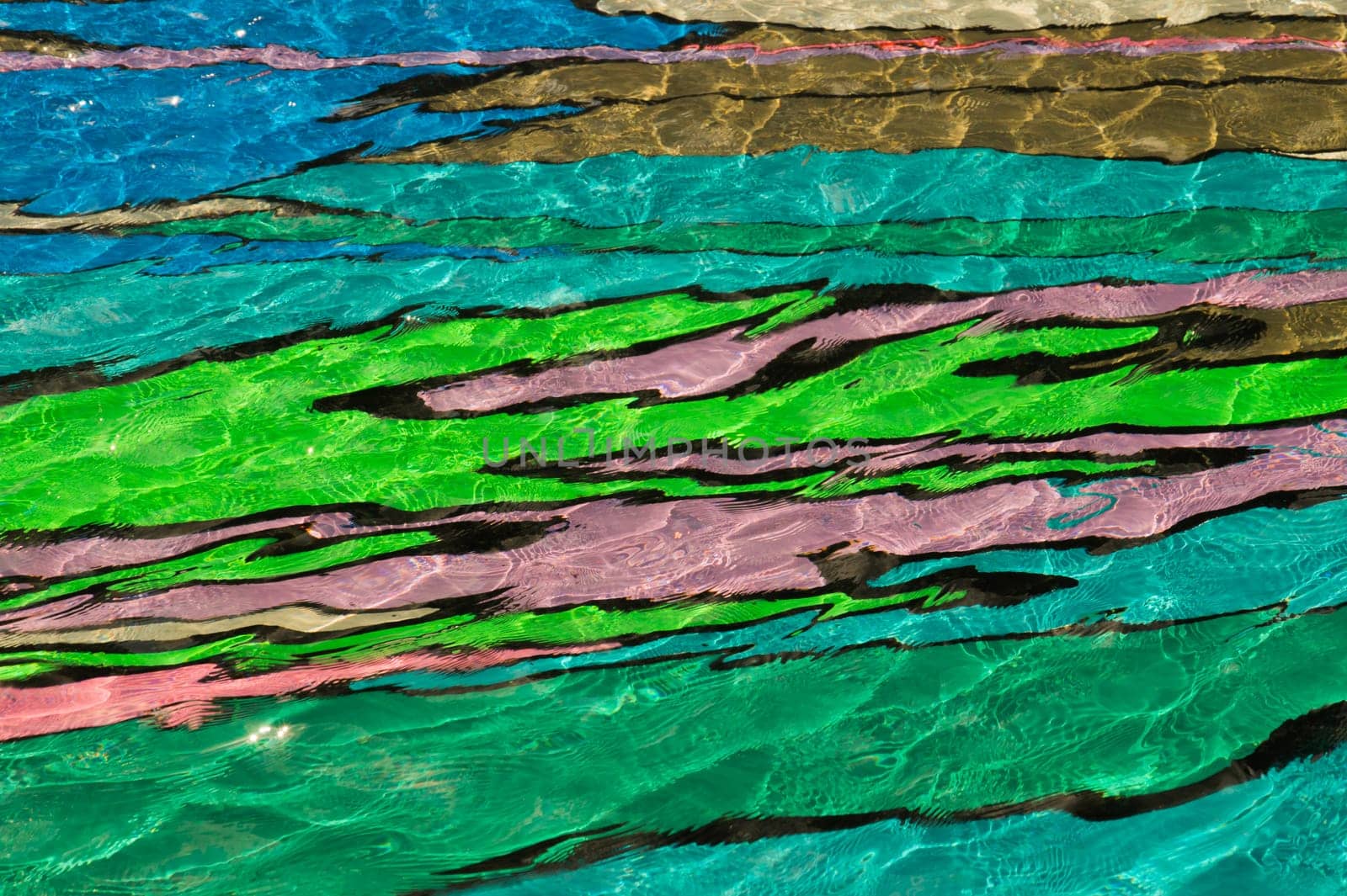 colorful pool water abstract background. colored bottom of the pool with rippled water