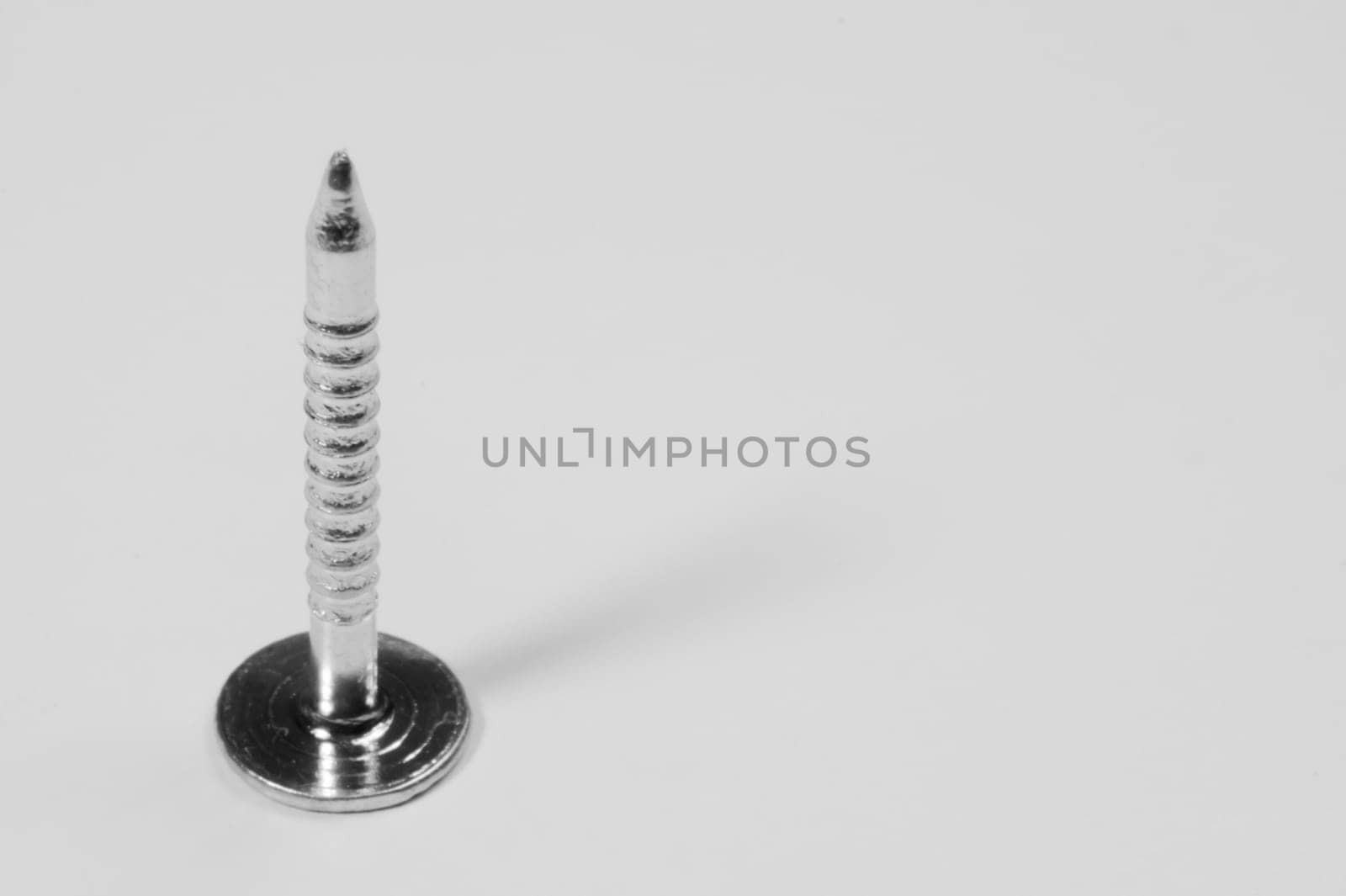 Metal nail isolated on white