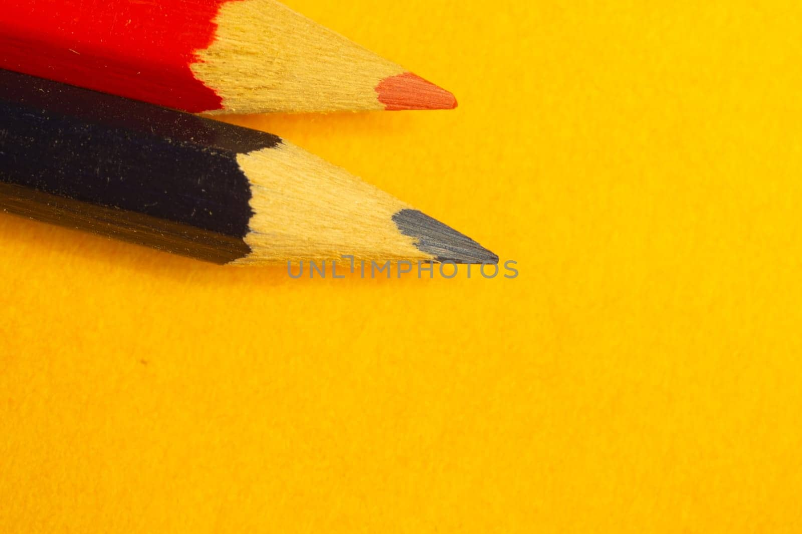 Colorful pencils isolated on yellow background. drawing supplies