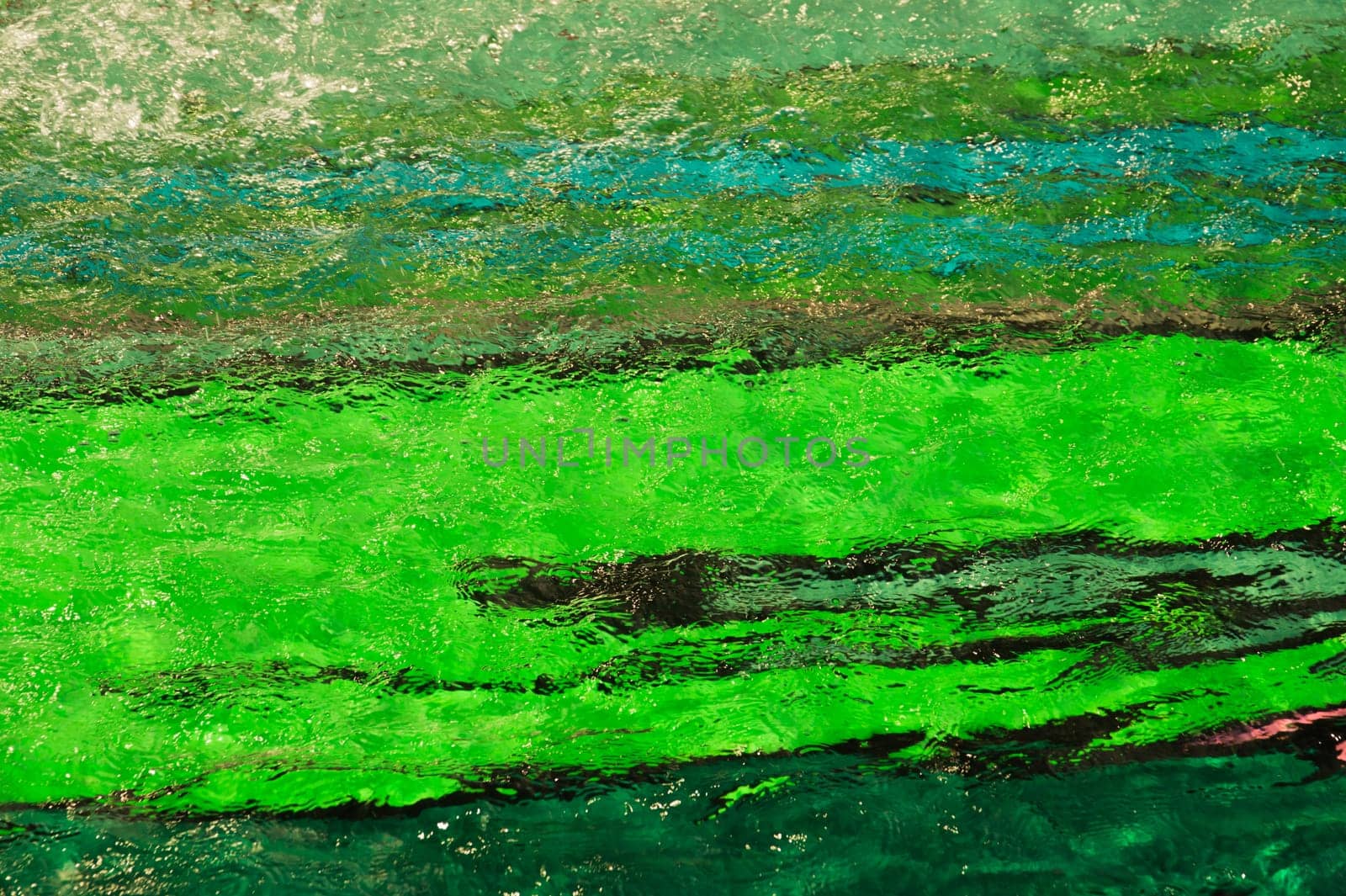 colorful pool water abstract background. colored bottom of the pool with rippled water