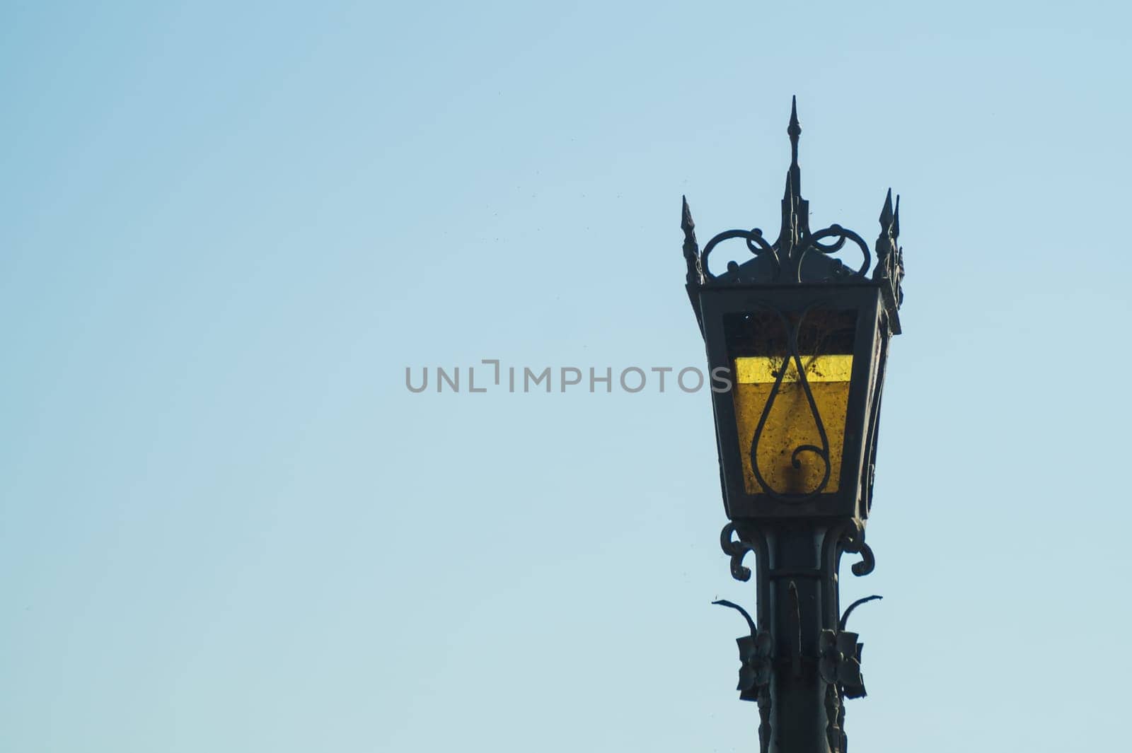 Vintage street lamp against the sky. Retro lantern. copy space
