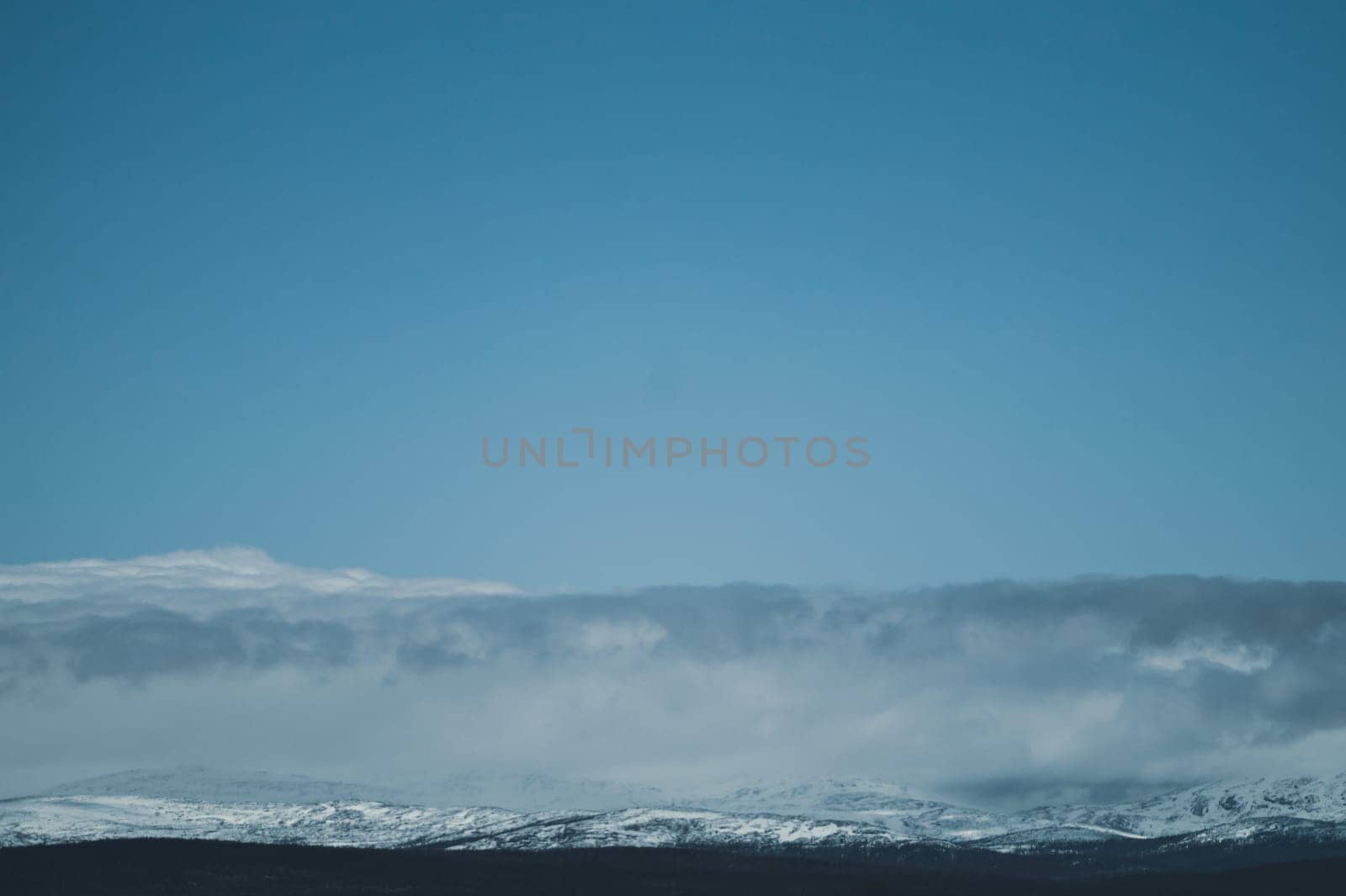 Mountain landscape background. snowy hills and forest background