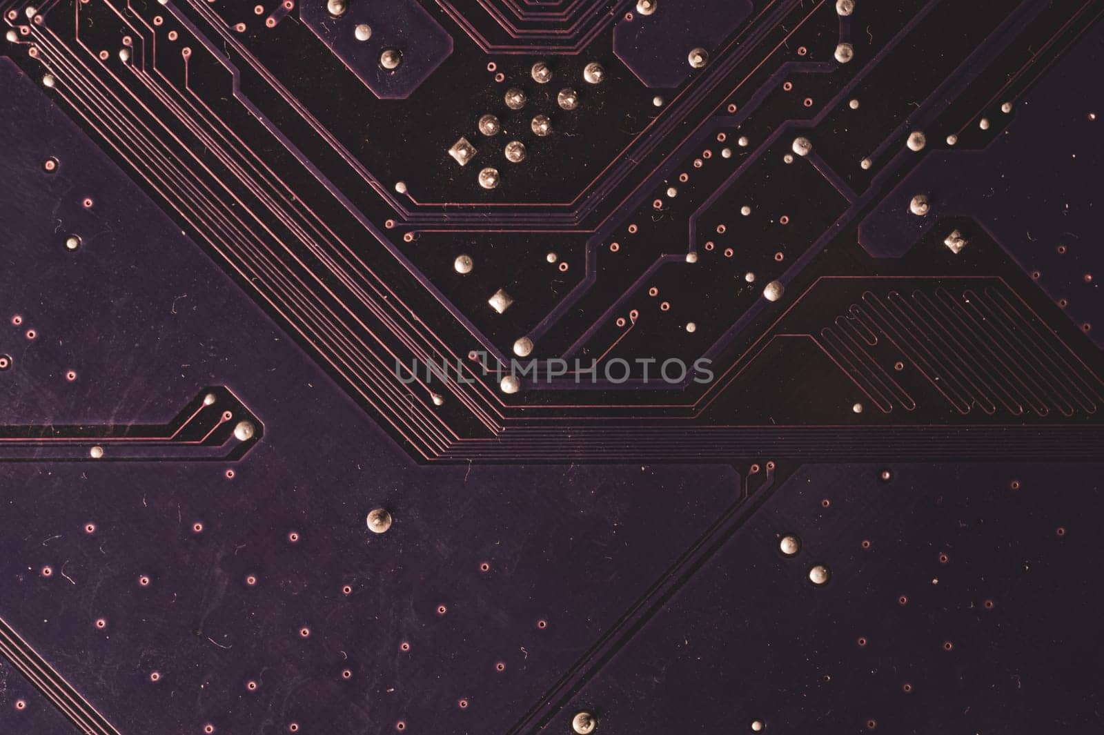 Spoiled motherboard close up. circuit board with dust and defects. modern technologies. micro elements of computer with connections and traces. Intelligent technology abstract background